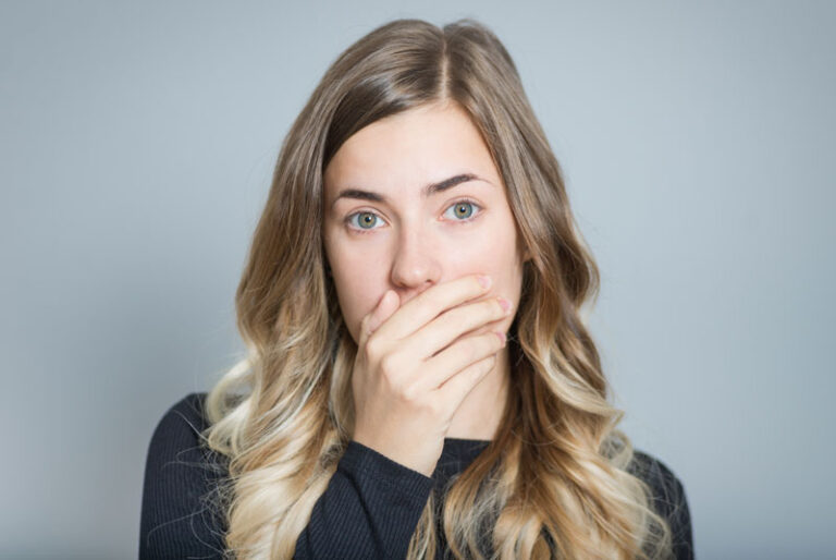 Dental Patient Hiding Her Mouth